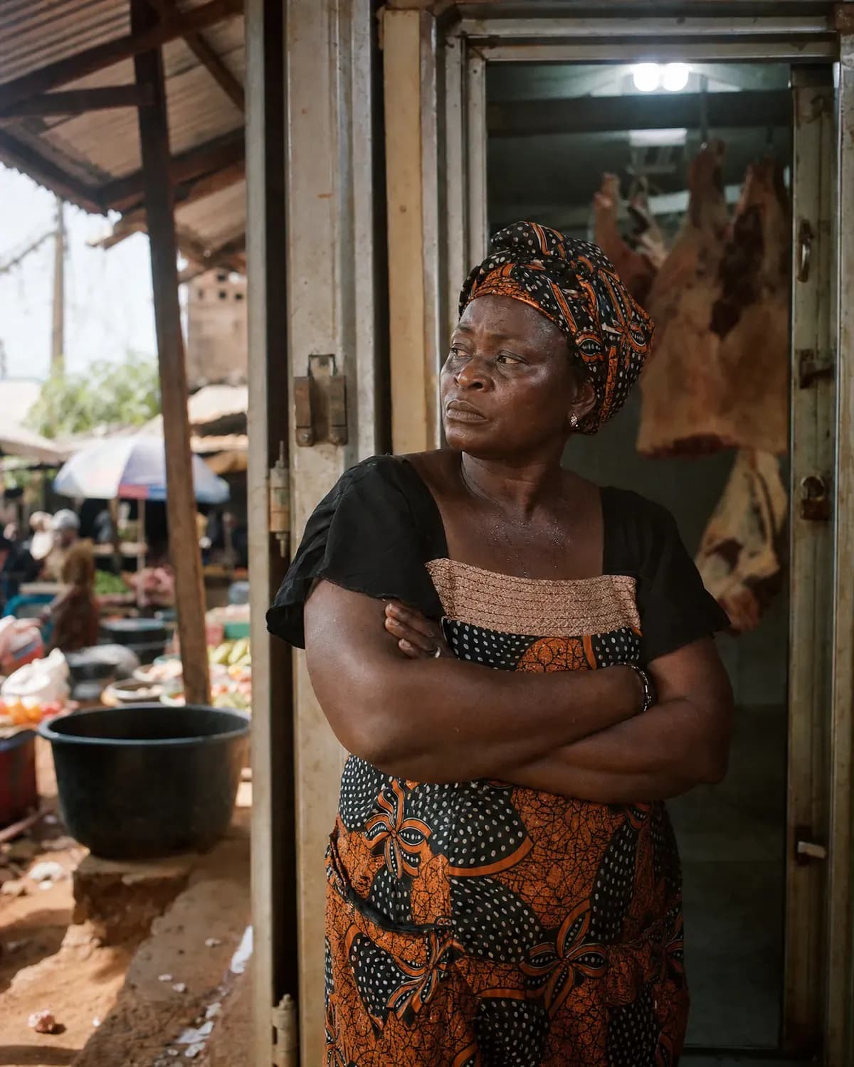 A market trader standing in the doorway of her cold room